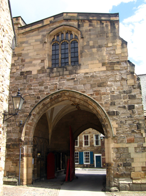 The gateway to the college. Above the entrance is a chapel, which was a common arrangement in medieval priories.